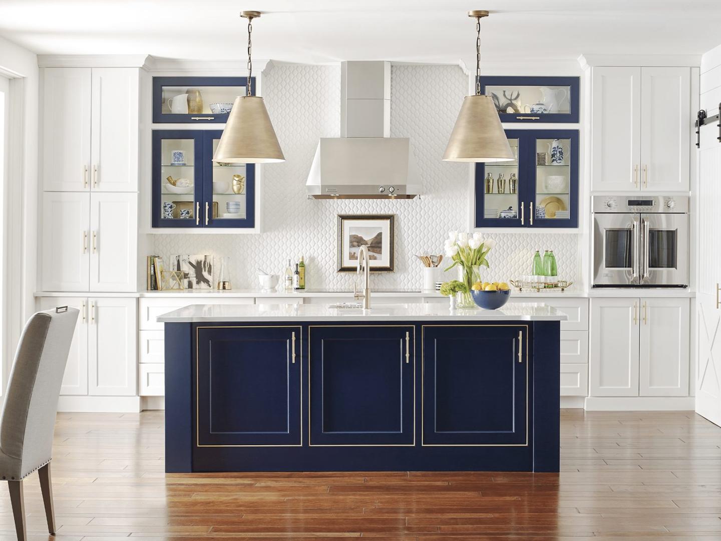 Remodeled kitchen with painted cabinetry and a center island
