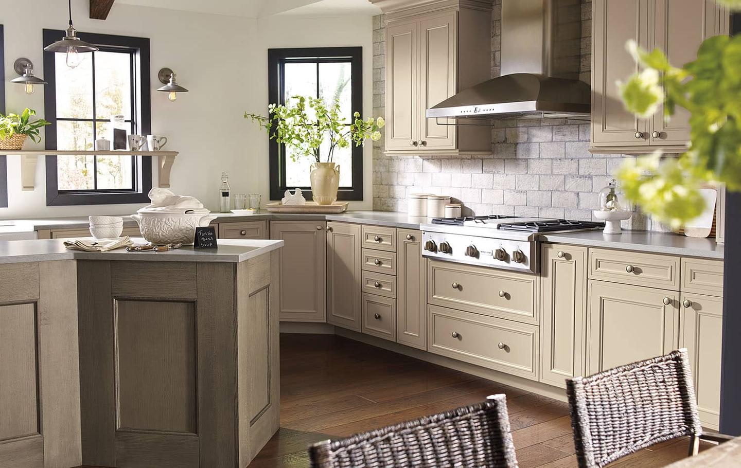 Kitchen with custom cabinetry, stone countertops and an island