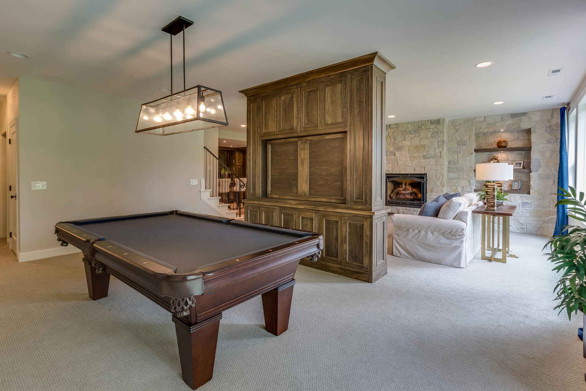 a living room filled with furniture and a fireplace