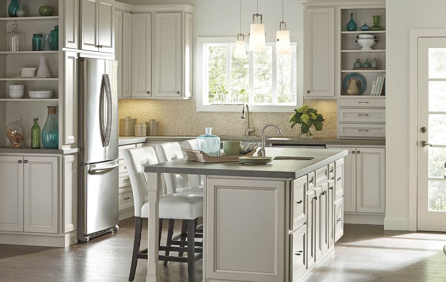 a kitchen with an island in the middle of a room