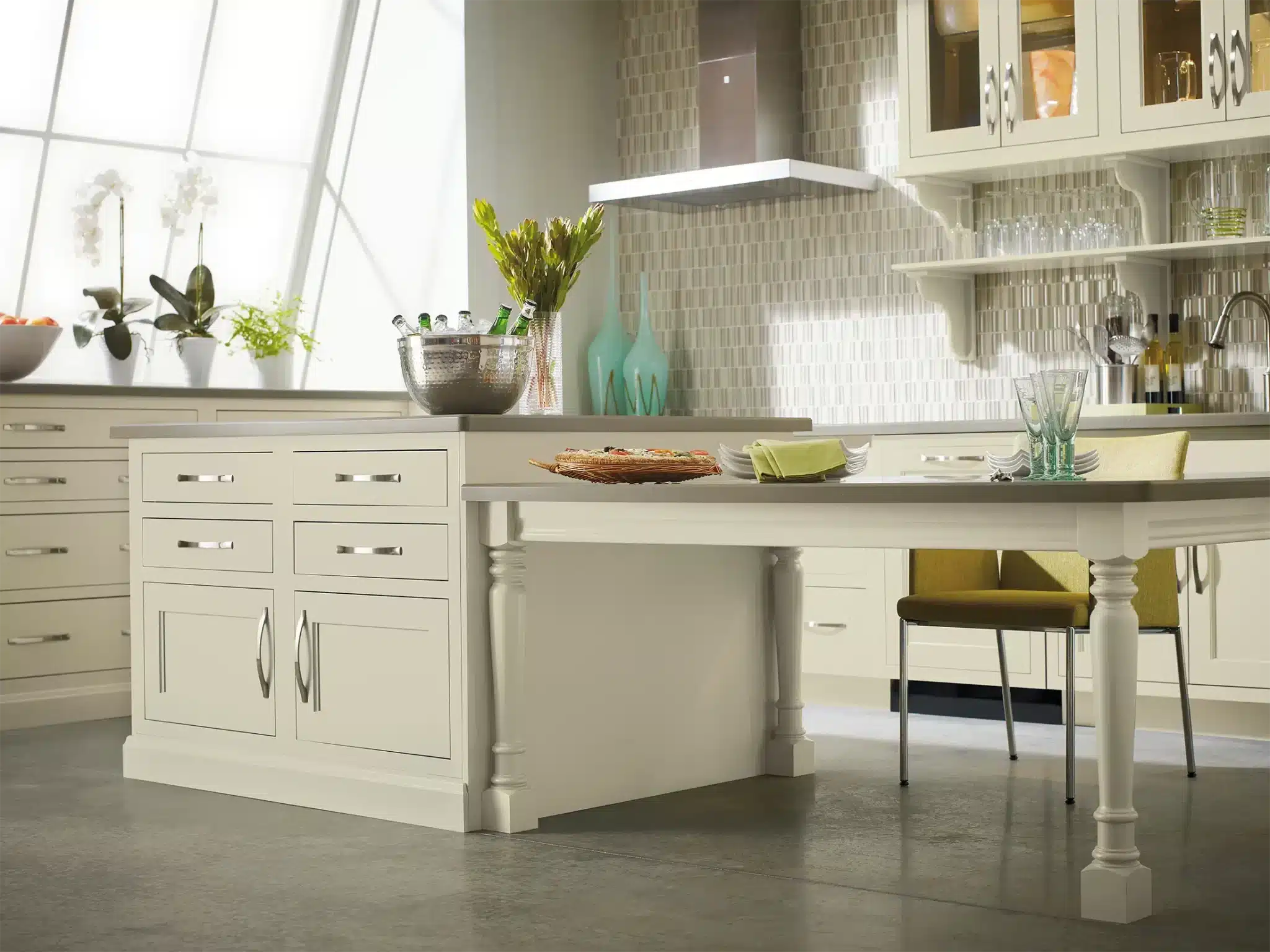 a kitchen with a table in front of a window